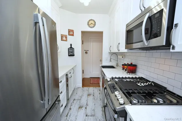 a dining room with furniture and a window