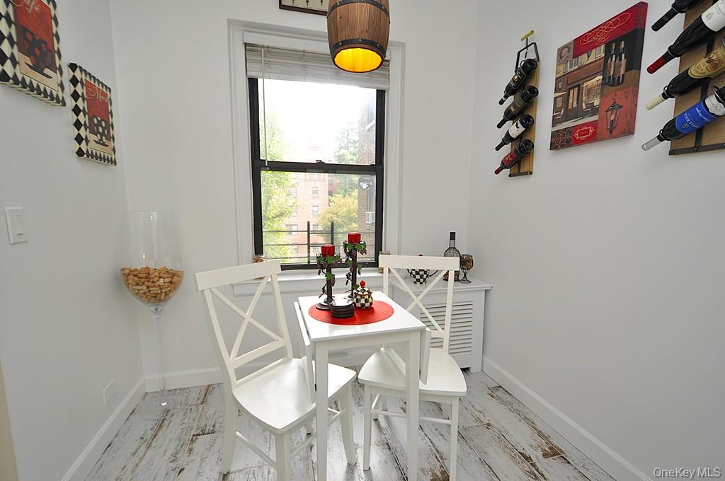 143 Garth Road, Unit 3L Scarsdale, NY 10583 - Photo 17 of 50 a view of a dining room with furniture and window