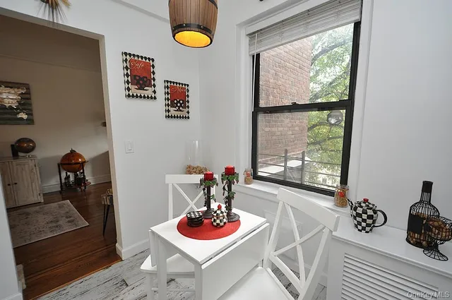 a kitchen with stainless steel appliances a stove a microwave and a table