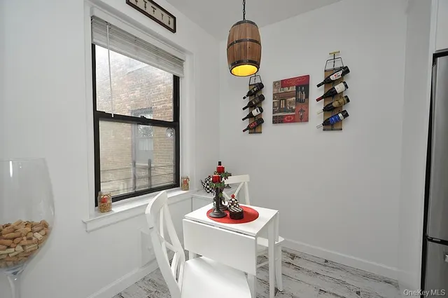 a view of a dining table and chairs in a kitchen
