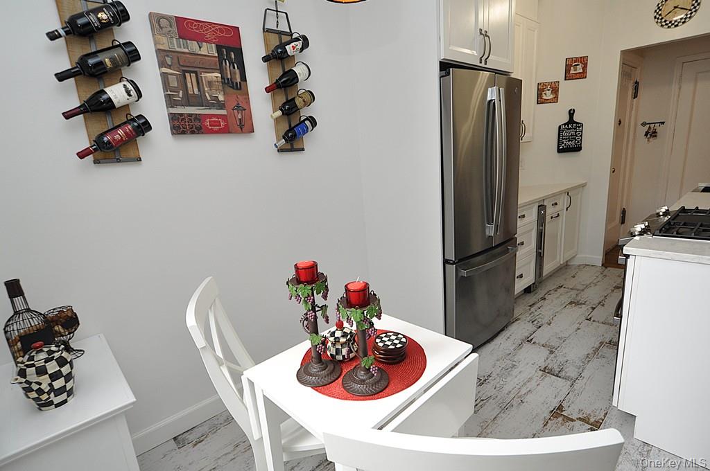 143 Garth Road, Unit 3L Scarsdale, NY 10583 - Photo 21 of 50 a view of a dining table and chairs in a kitchen