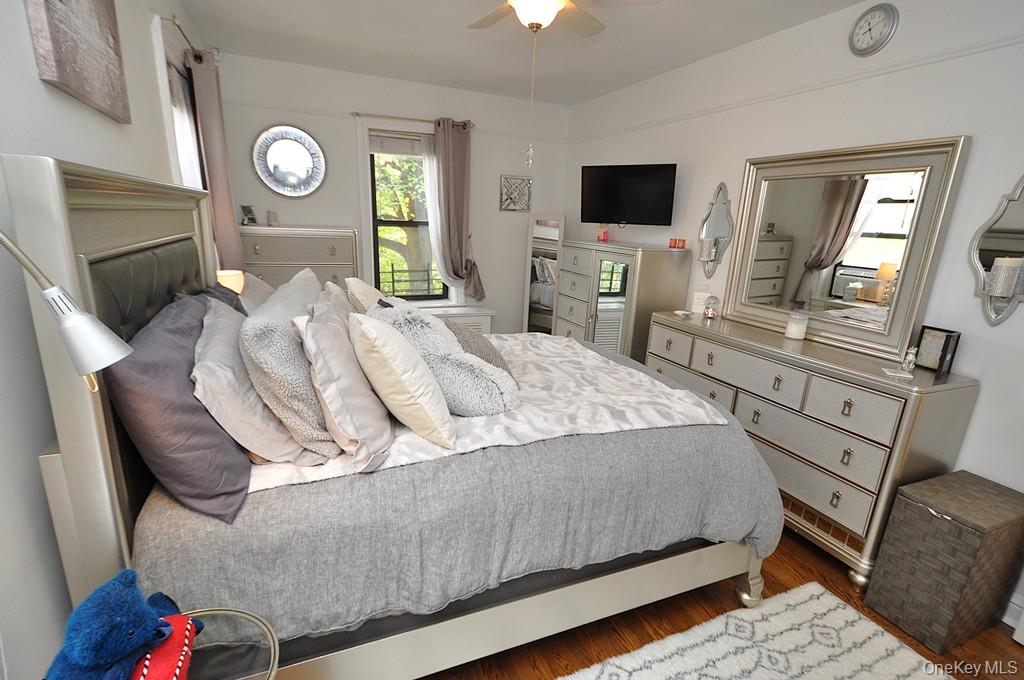 143 Garth Road, Unit 3L Scarsdale, NY 10583 - Photo 25 of 50 a living room with furniture and a flat screen tv