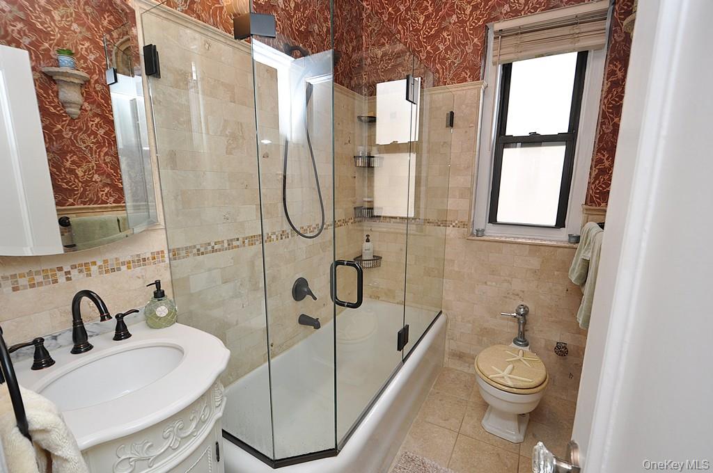 143 Garth Road, Unit 3L Scarsdale, NY 10583 - Photo 26 of 50 a bathroom with a sink toilet and shower