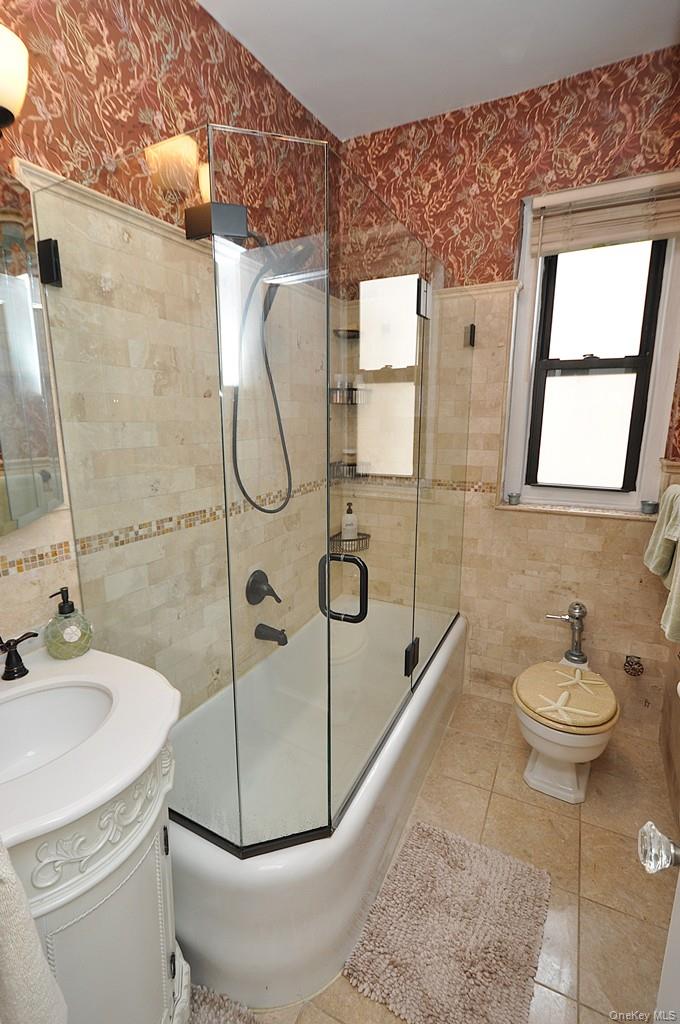 143 Garth Road, Unit 3L Scarsdale, NY 10583 - Photo 27 of 50 a bathroom with a sink toilet and shower