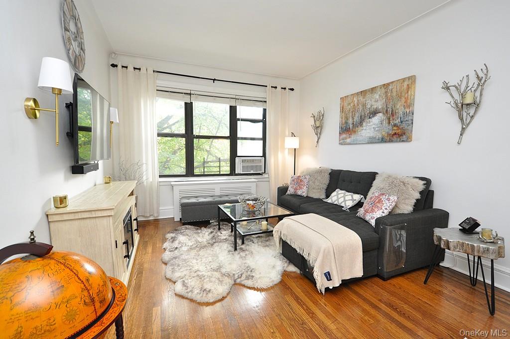 143 Garth Road, Unit 3L Scarsdale, NY 10583 - Photo 3 of 50 a living room with furniture and a large window