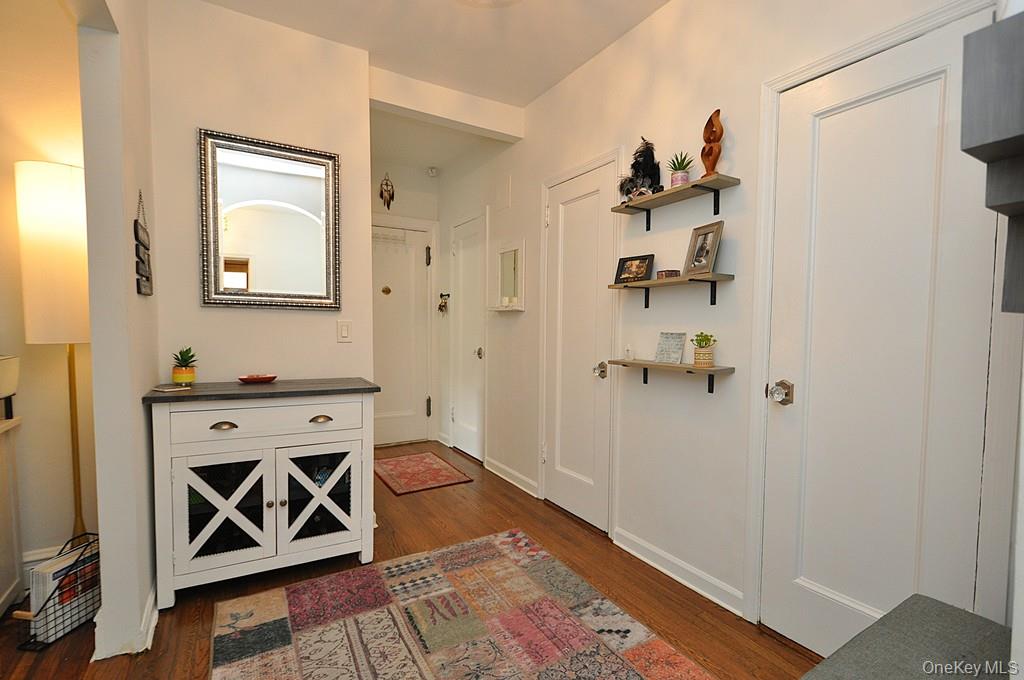143 Garth Road, Unit 3L Scarsdale, NY 10583 - Photo 31 of 50 a view of a hallway to a livingroom with furniture