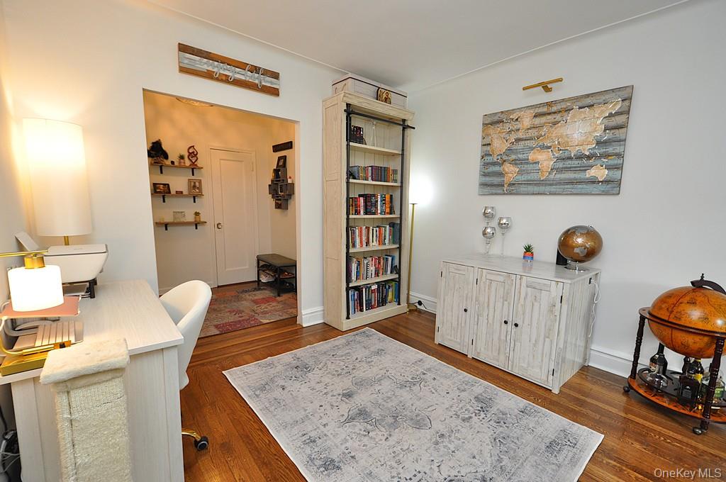 143 Garth Road, Unit 3L Scarsdale, NY 10583 - Photo 34 of 50 a living room with furniture and wooden floor