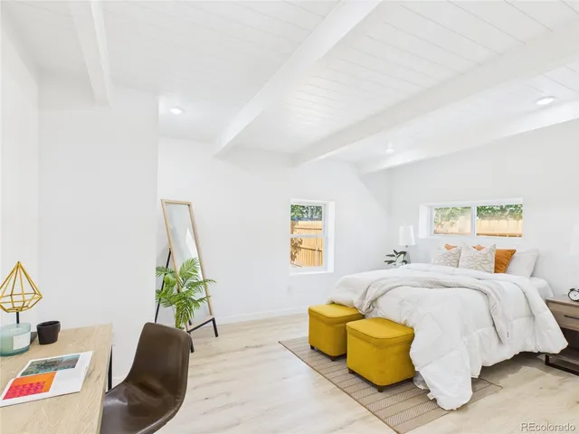 a bedroom with a bed and a couch