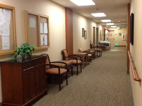 a lobby with furniture and potted plants