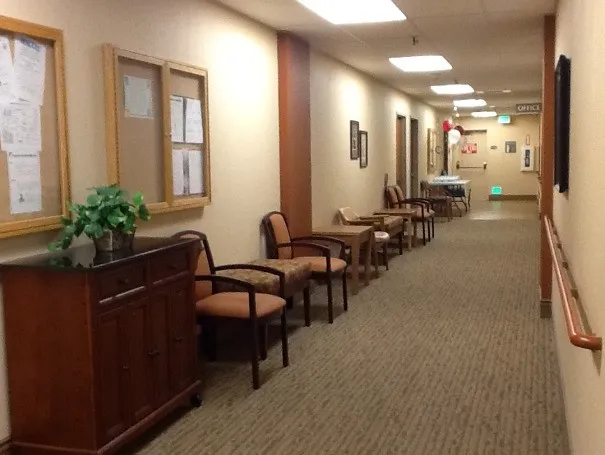 a lobby with furniture and potted plants