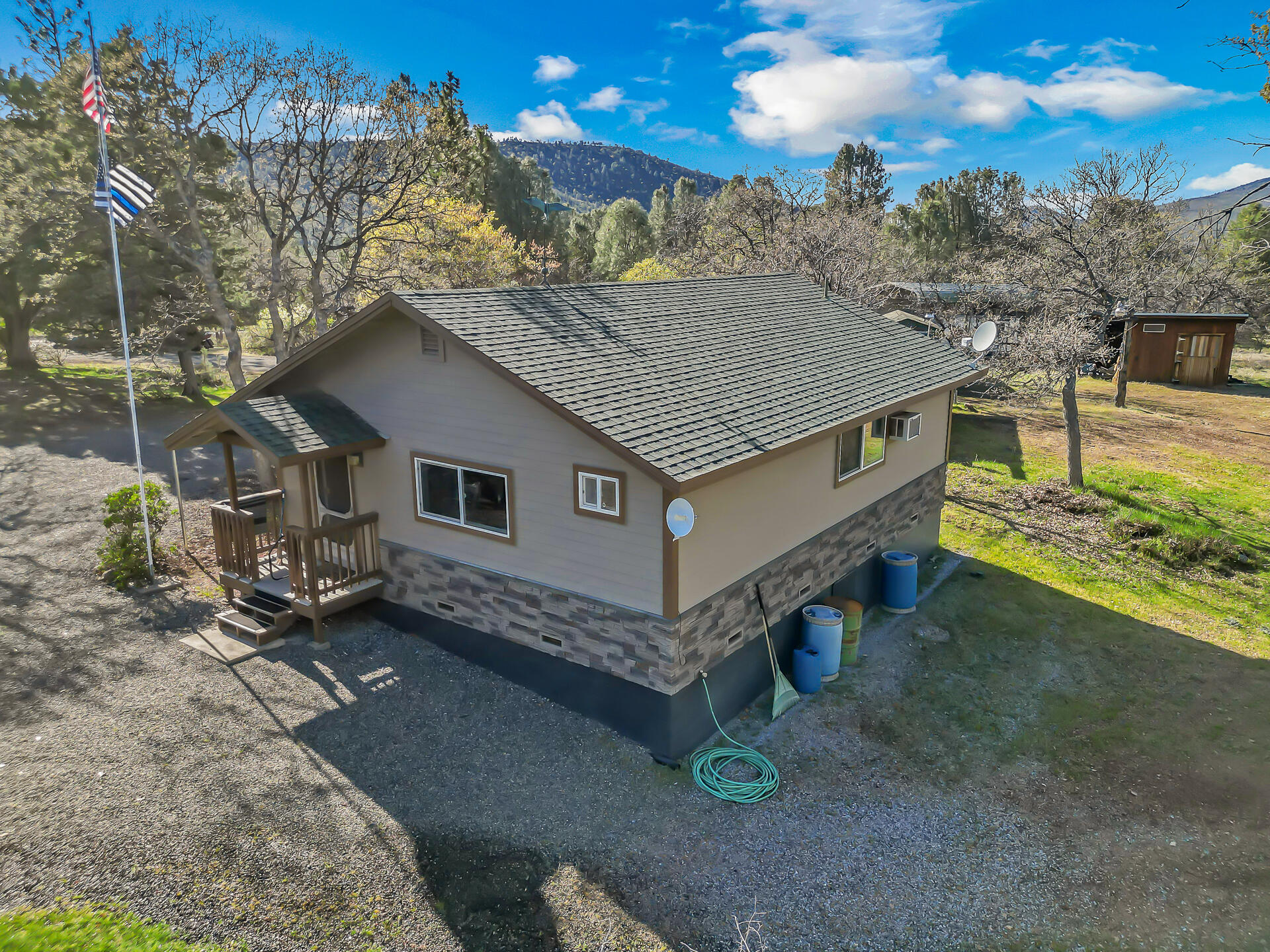 43007 Shoshoni Loop Fall River Mills, CA 96028 - Photo 73 of 87 a aerial view of a house with a yard