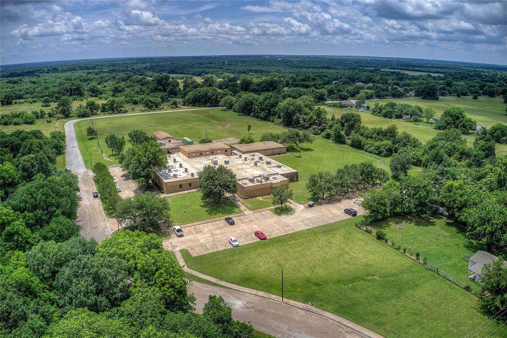 Tbd Washington Street Commerce, TX 75428 - Photo 5 of 13 an aerial view of a house with a yard