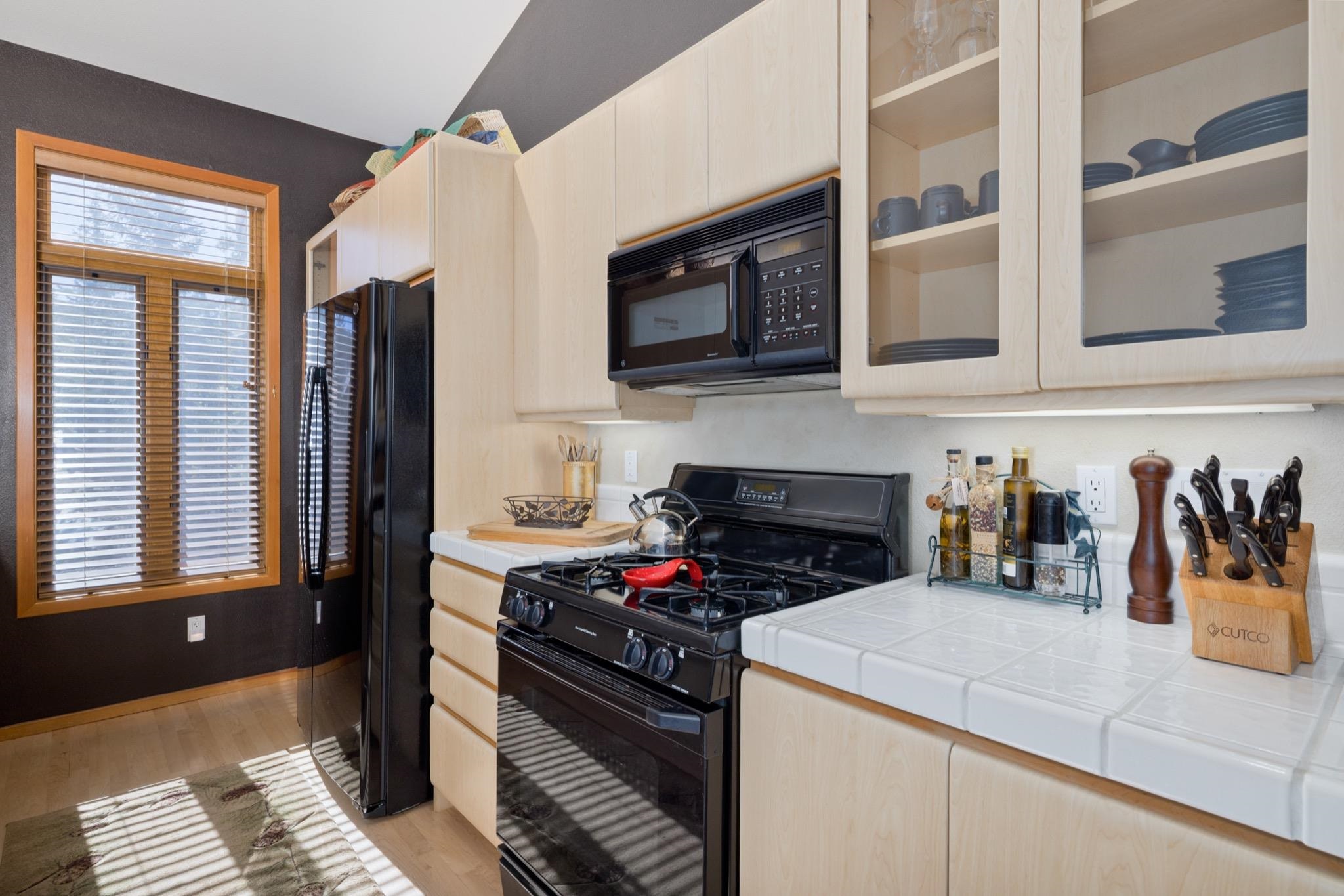 930 Links Way, Unit 930 Mammoth Lakes, CA 93546 - Photo 15 of 40 a kitchen with a stove and a refrigerator