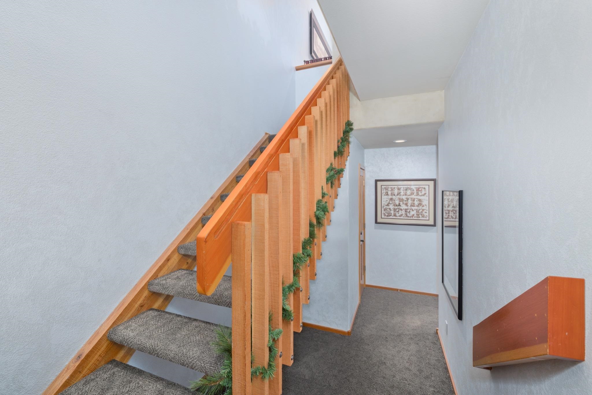 930 Links Way, Unit 930 Mammoth Lakes, CA 93546 - Photo 21 of 40 a view of staircase with railing and white walls