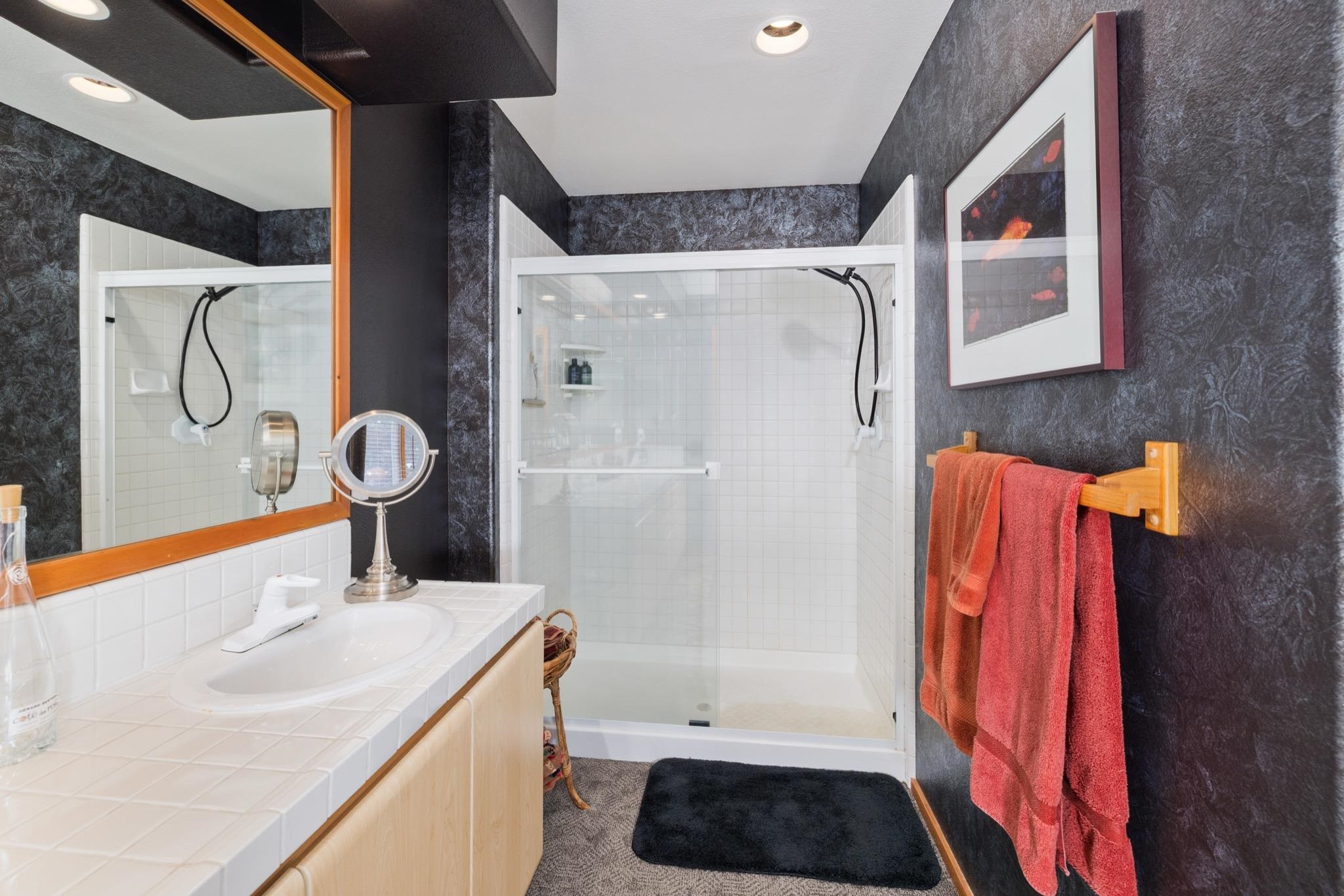 930 Links Way, Unit 930 Mammoth Lakes, CA 93546 - Photo 29 of 40 a bathroom with a sink a toilet and shower