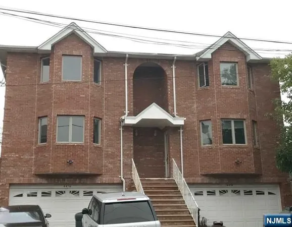 a front view of a house with yard