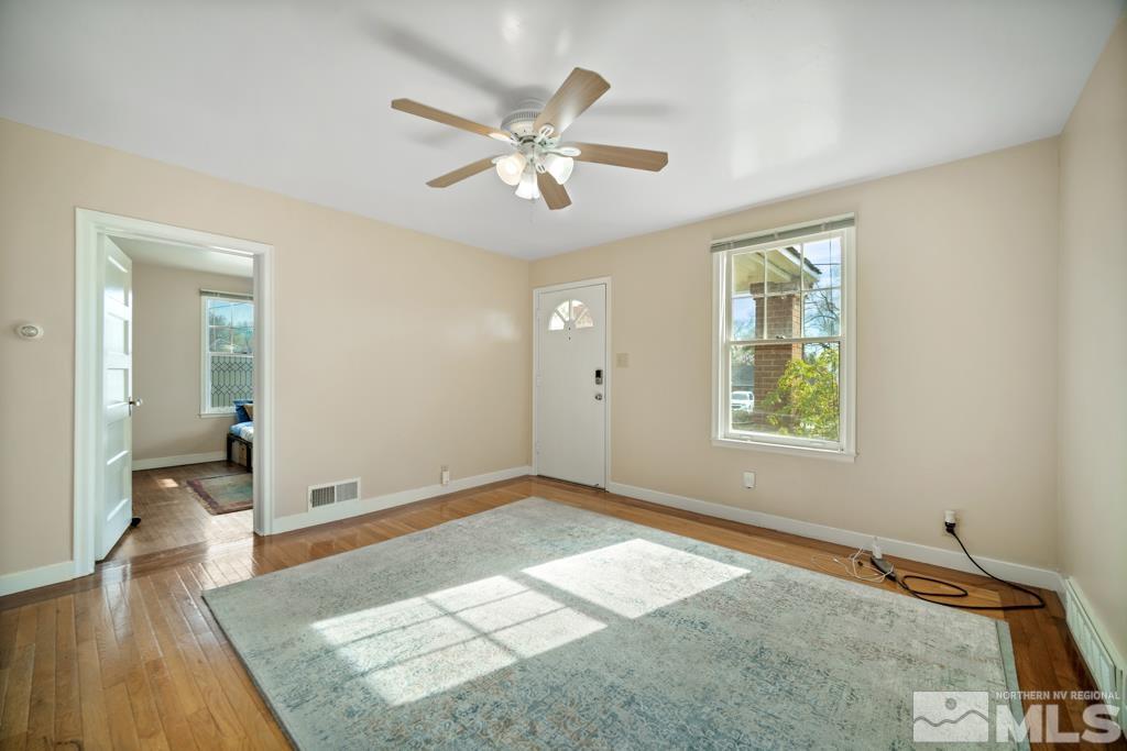 1221 Keystone Avenue Reno, NV 89503 - Photo 8 of 31 wooden floor in an empty room with a window