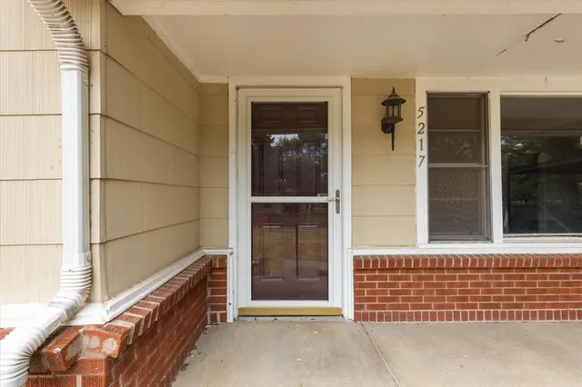 a view of a brick house with an empty room