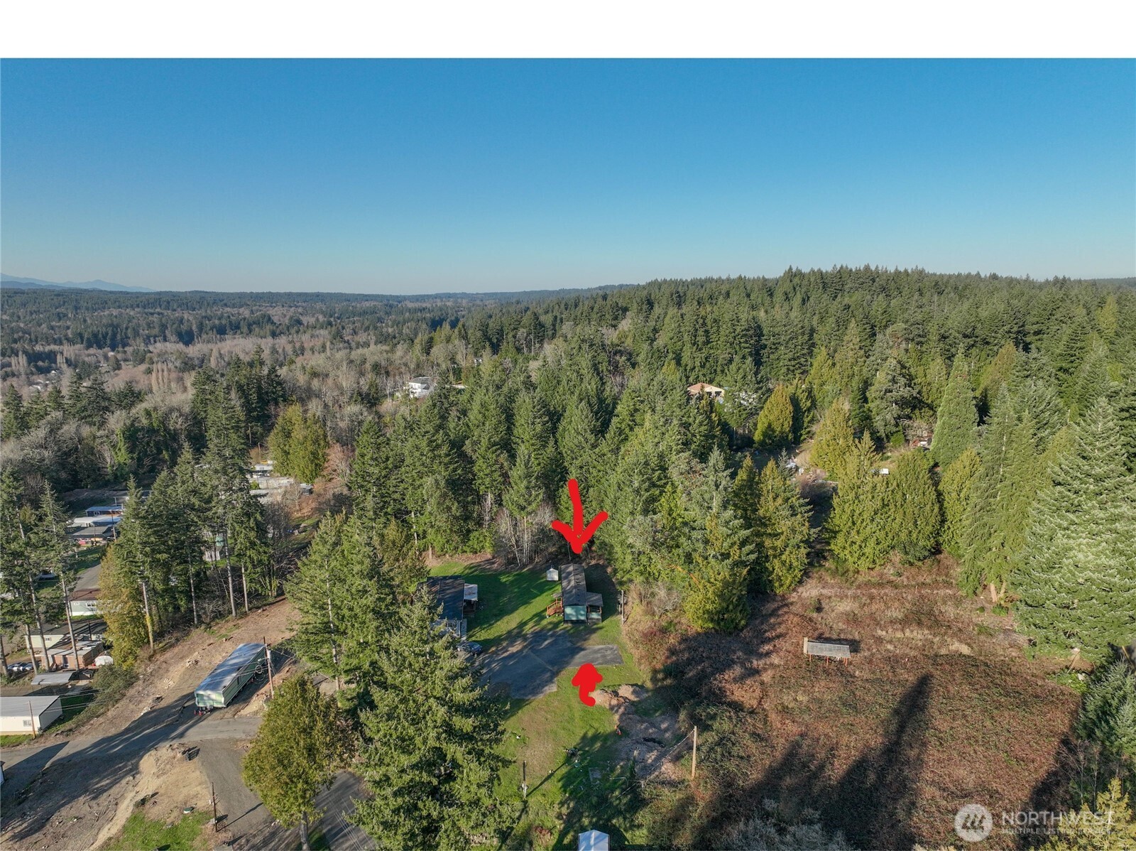 15503 Cedar Park Road Southeast, Unit 35C Olalla, WA 98359 - Photo 2 of 23 an aerial view of a houses with a yard