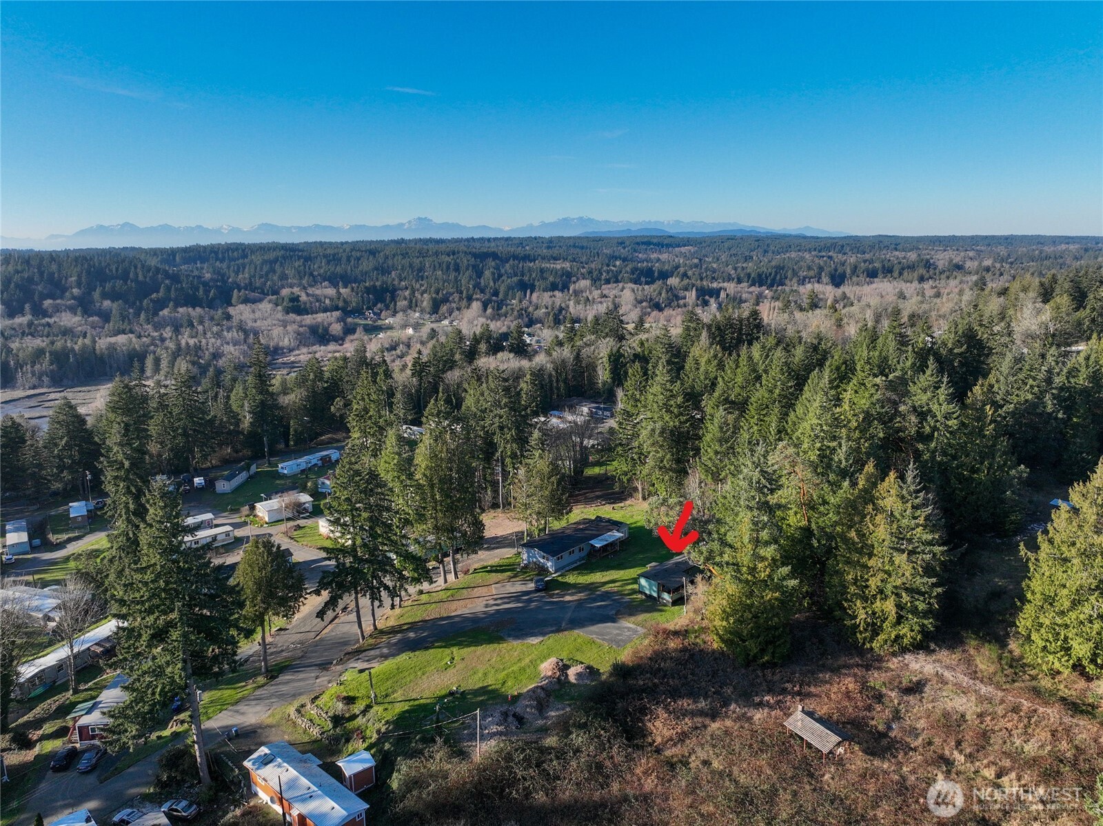 15503 Cedar Park Road Southeast, Unit 35C Olalla, WA 98359 - Photo 3 of 23 an aerial view of a houses with a yard
