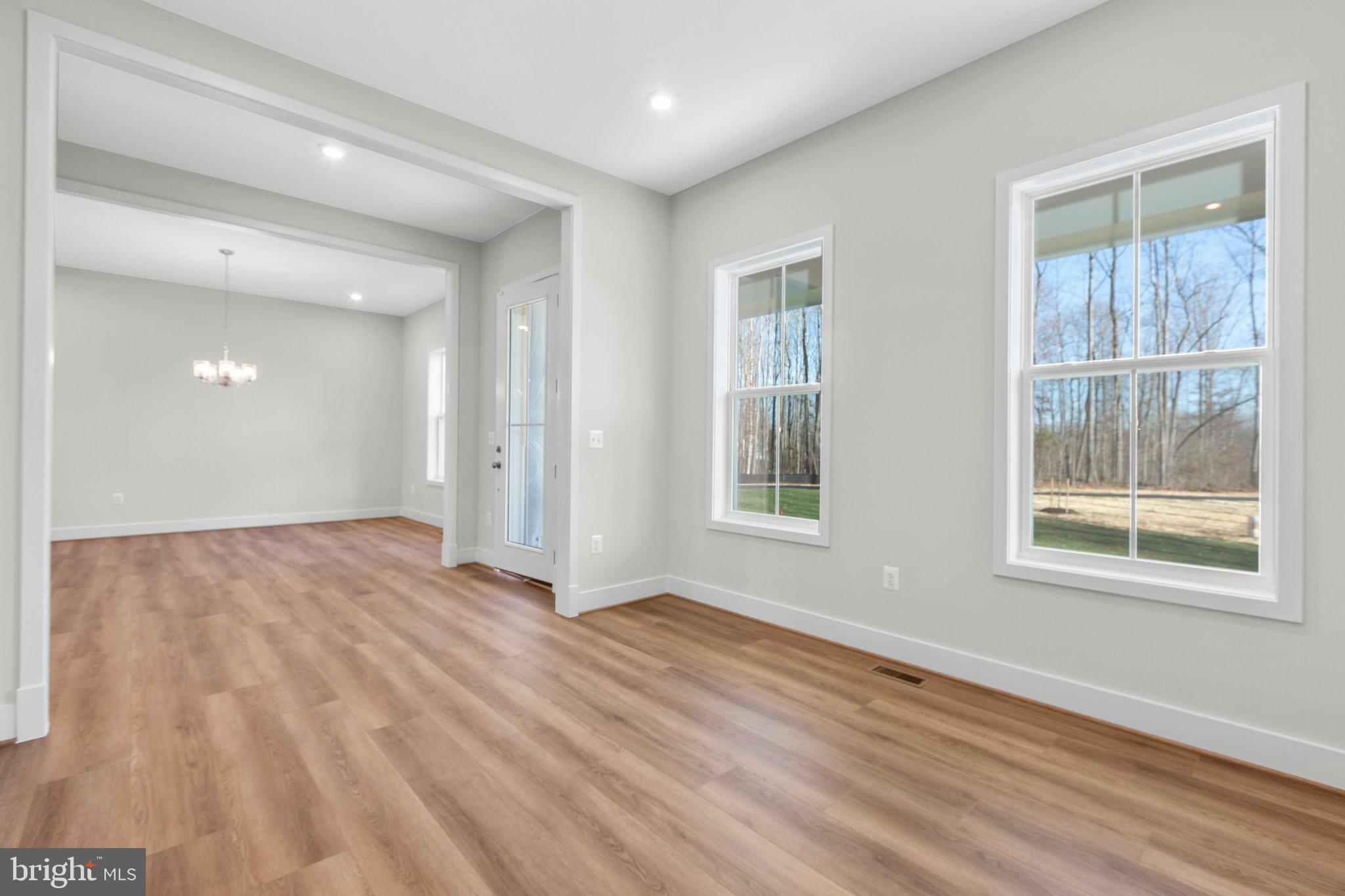 10 Burwell Road Nokesville, VA 20181 - Photo 43 of 57 a view of an empty room with wooden floor and a window