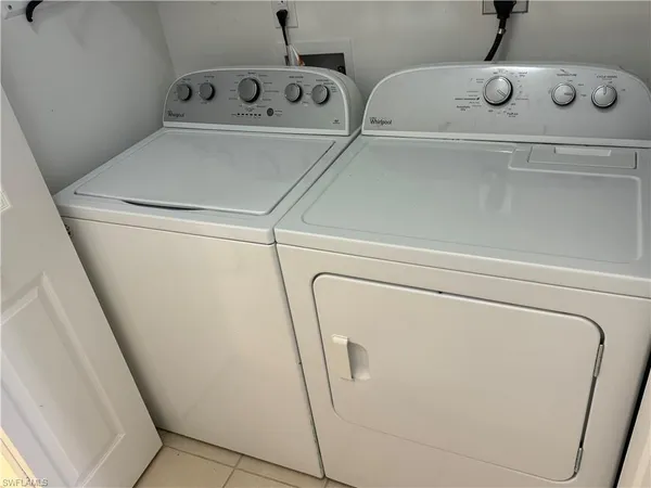 a white toilet sitting next to a sink