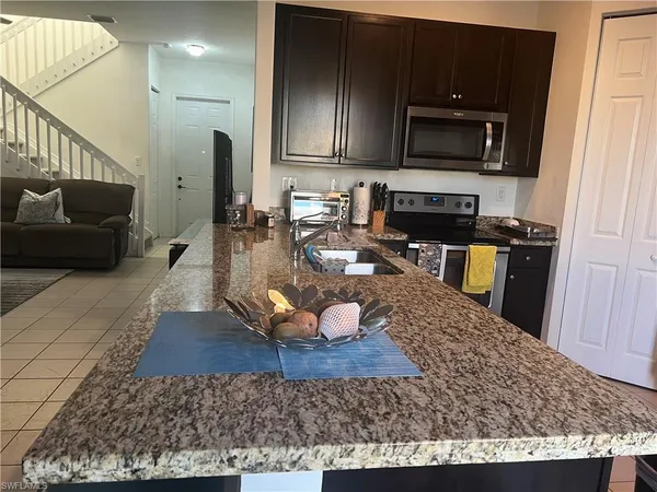 a room with gym equipment and a flat screen tv