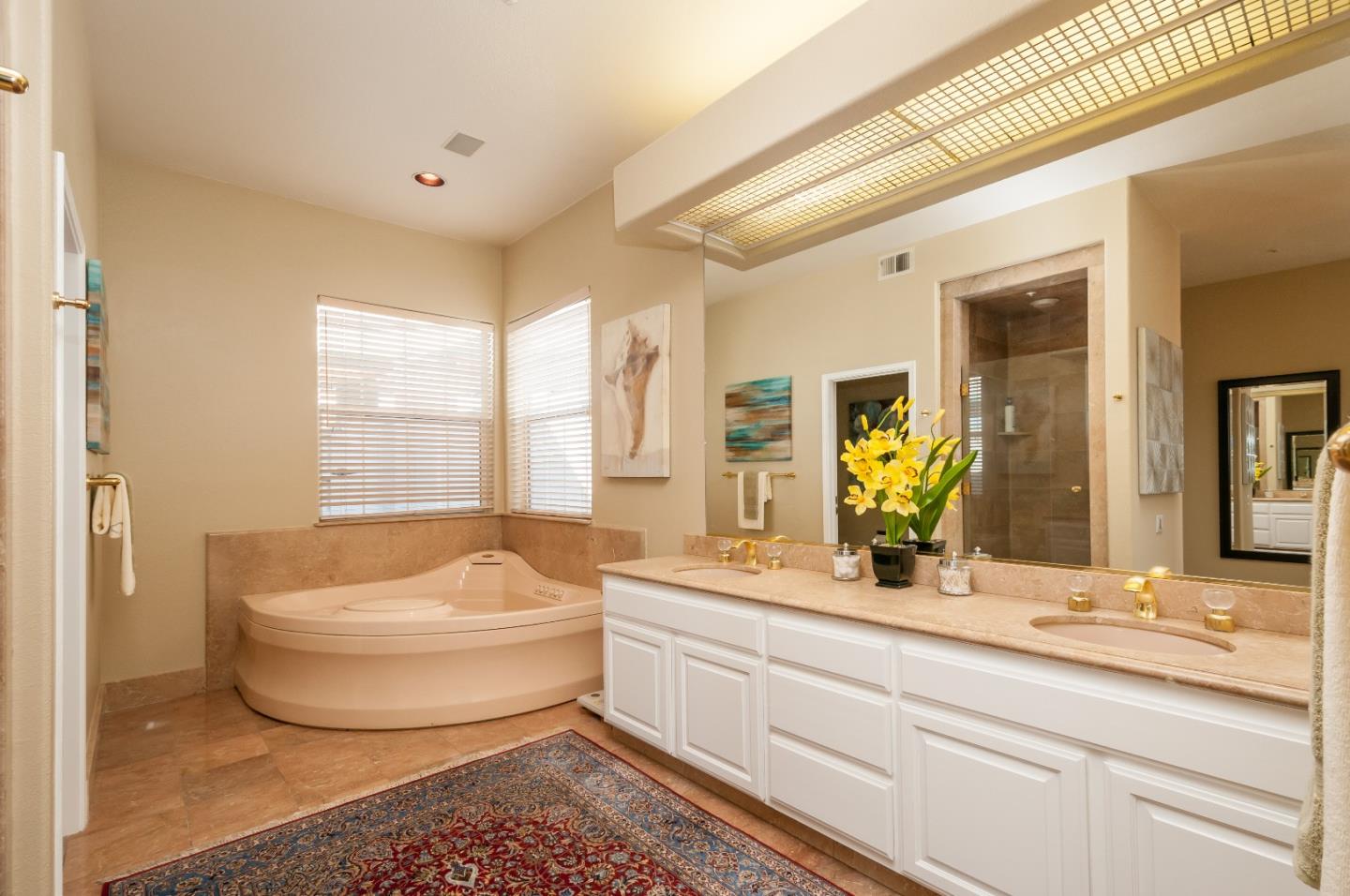 720 Promontory Point Lane, Unit 2402 Foster City, CA 94404 - Photo 12 of 24 a spacious bathroom with a double vanity sink tub and mirror