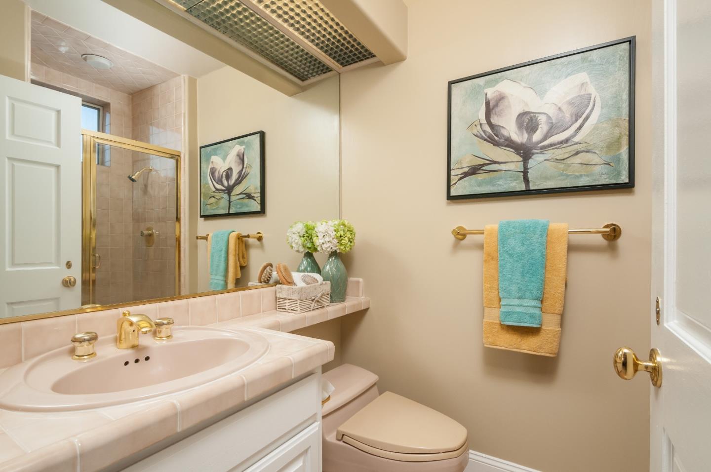720 Promontory Point Lane, Unit 2402 Foster City, CA 94404 - Photo 14 of 24 a bathroom with a toilet a sink and mirror