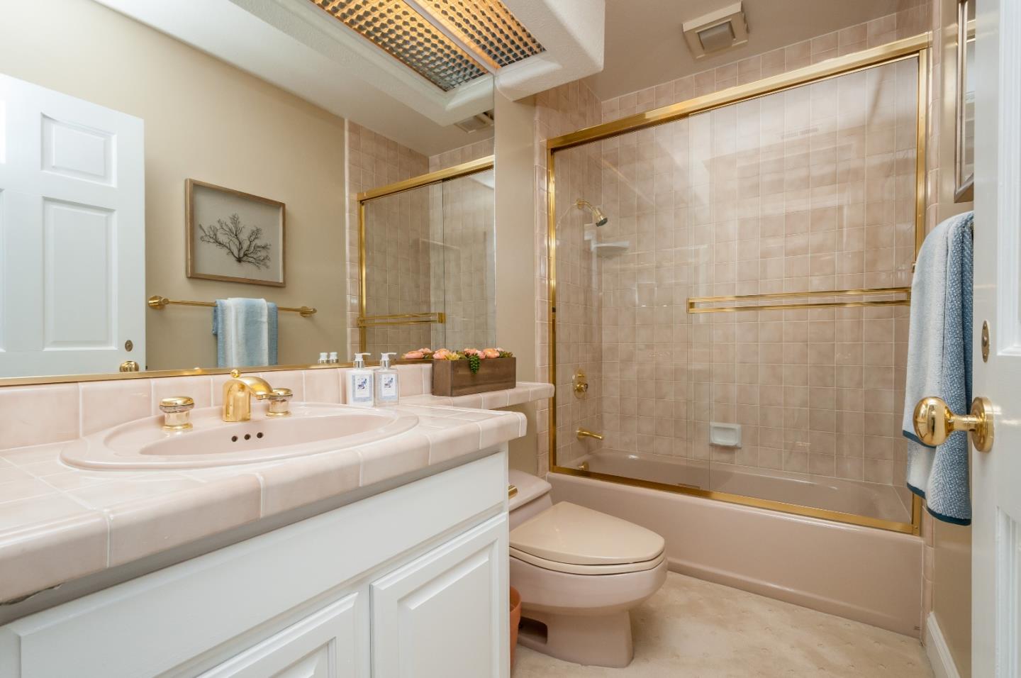 720 Promontory Point Lane, Unit 2402 Foster City, CA 94404 - Photo 16 of 24 a bathroom with a sink a toilet and shower