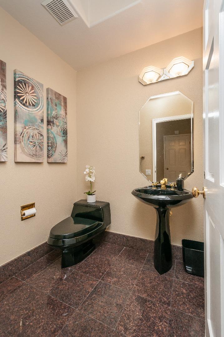 720 Promontory Point Lane, Unit 2402 Foster City, CA 94404 - Photo 17 of 24 a bathroom with a sink and a mirror