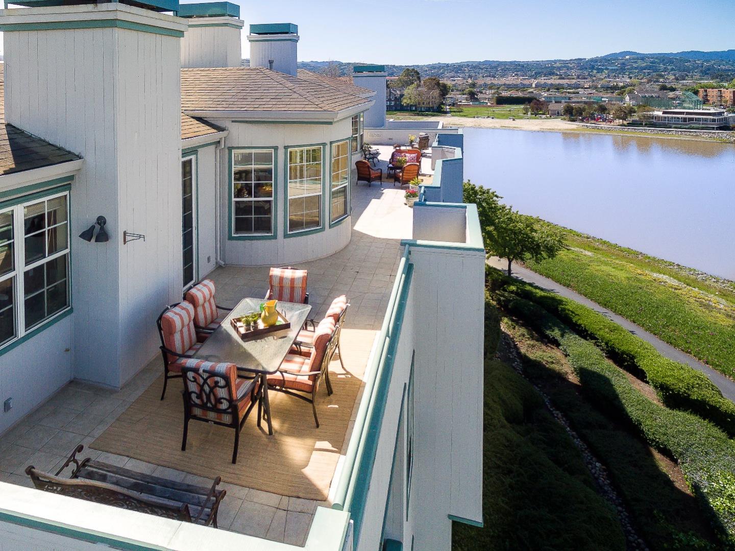 720 Promontory Point Lane, Unit 2402 Foster City, CA 94404 - Photo 18 of 24 a balcony with table and chairs