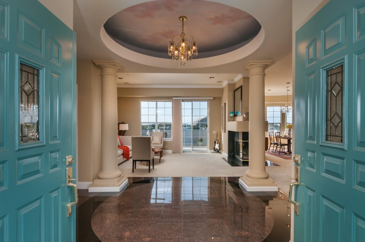 720 Promontory Point Lane, Unit 2402 Foster City, CA 94404 - Photo 2 of 24 a view of a dining room with furniture and chandelier