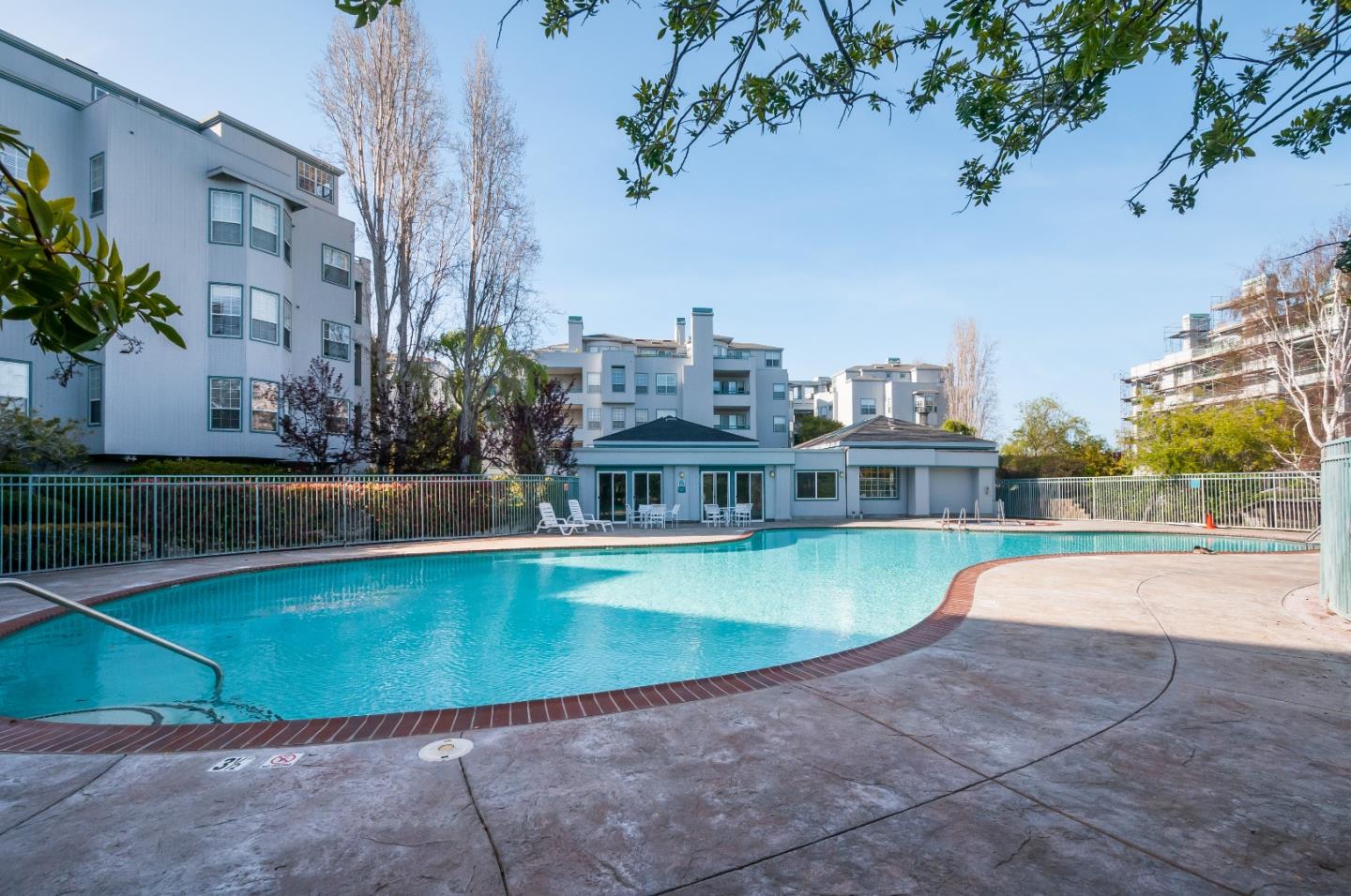 720 Promontory Point Lane, Unit 2402 Foster City, CA 94404 - Photo 24 of 24 a view of a swimming pool next to a building