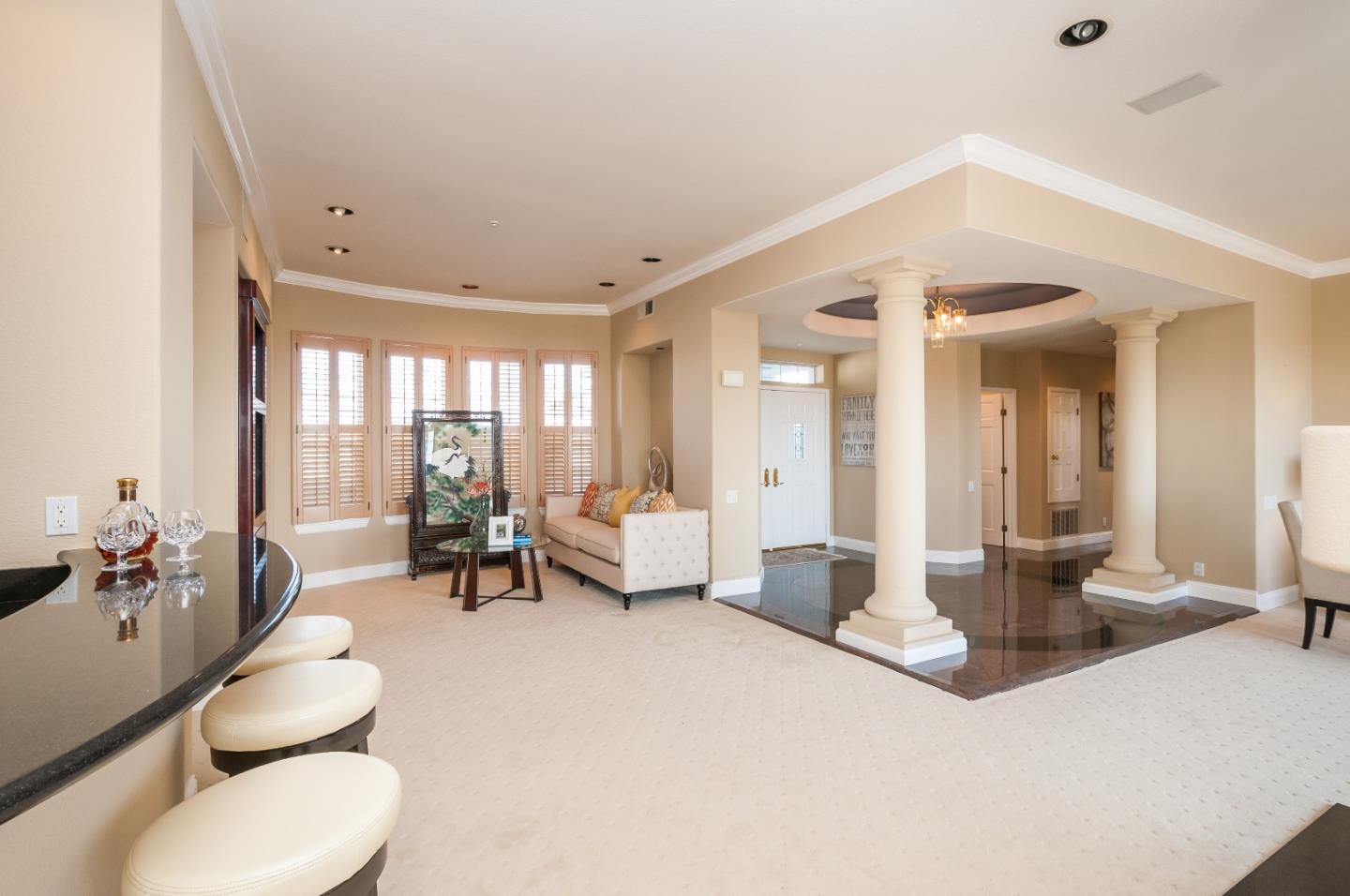 720 Promontory Point Lane, Unit 2402 Foster City, CA 94404 - Photo 3 of 24 a living room with furniture and a large window