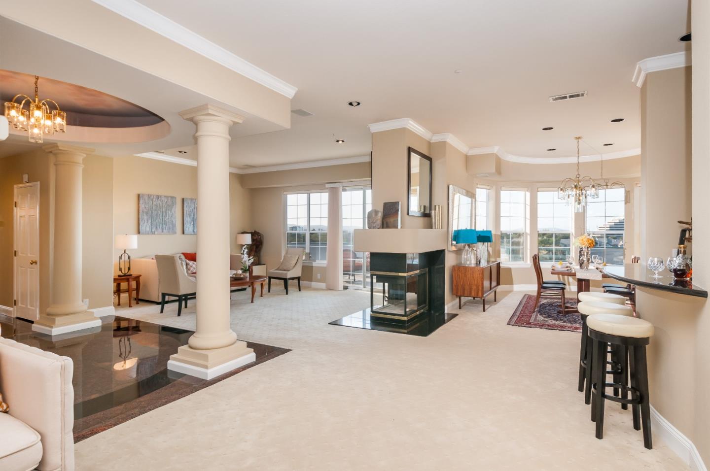 720 Promontory Point Lane, Unit 2402 Foster City, CA 94404 - Photo 4 of 24 a living room with furniture a fireplace and a table