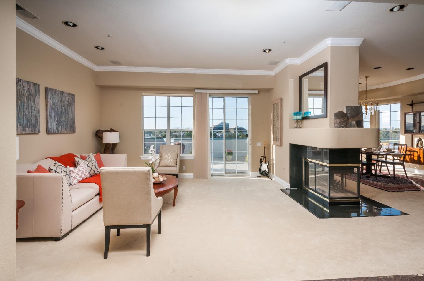 720 Promontory Point Lane, Unit 2402 Foster City, CA 94404 - Photo 5 of 24 a living room with fireplace furniture and a table