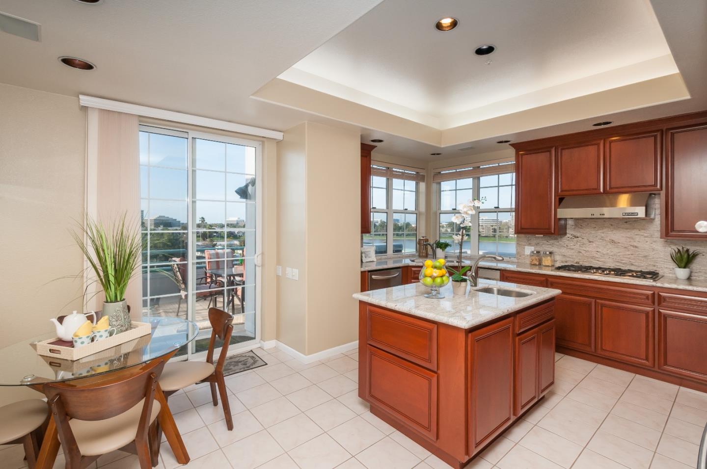 720 Promontory Point Lane, Unit 2402 Foster City, CA 94404 - Photo 10 of 24 a kitchen with stainless steel appliances granite countertop a stove a sink and a refrigerator
