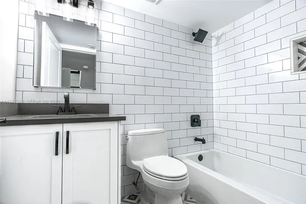 a bathroom with a bathtub and sink