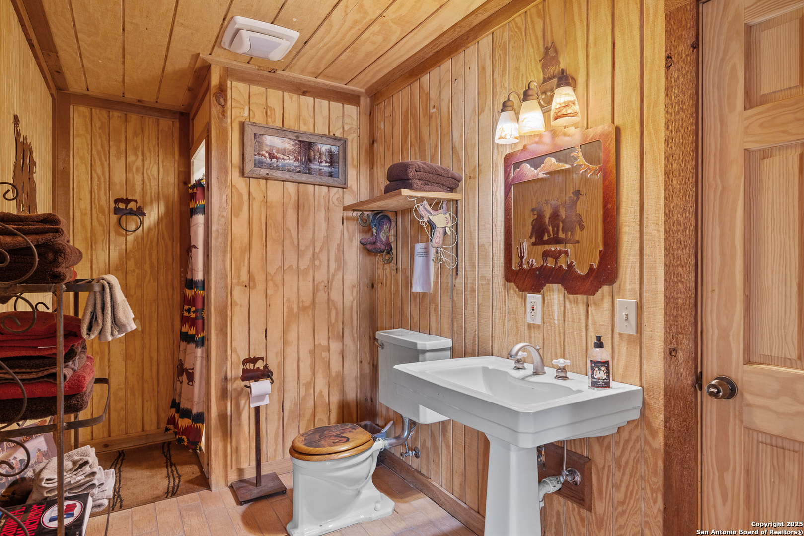 1897 Kyle Ranch Road Bandera, TX 78003 - Photo 12 of 48 a bathroom with a sink toilet and shower