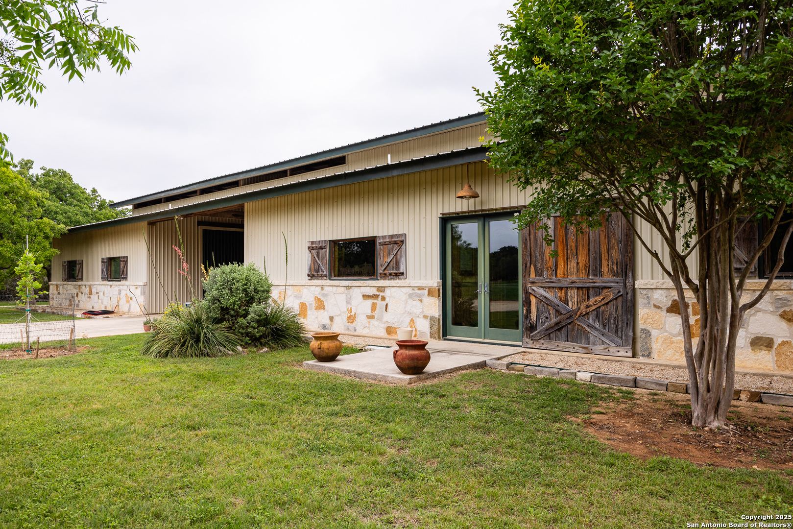 1897 Kyle Ranch Road Bandera, TX 78003 - Photo 15 of 48 a front view of a house with patio