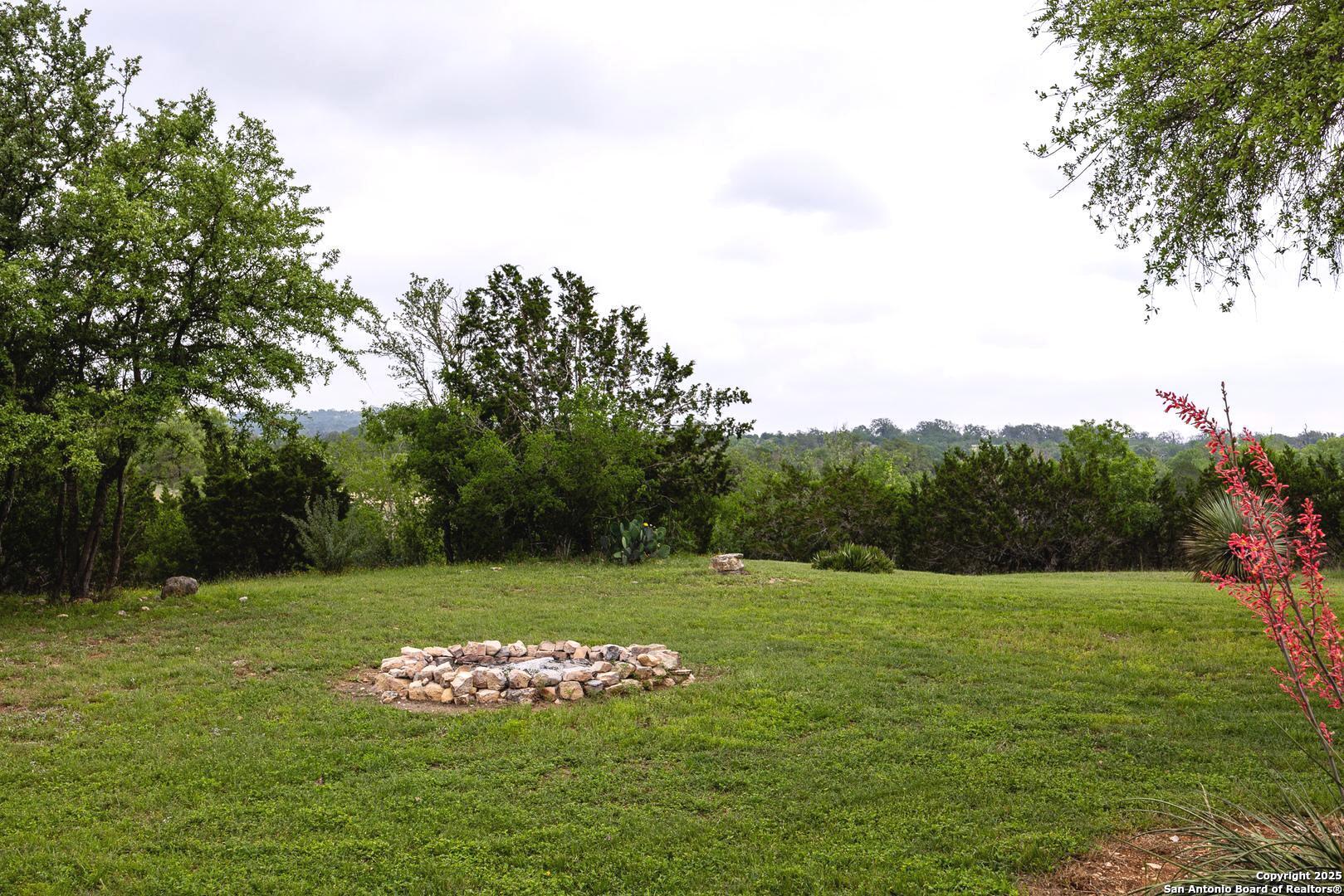 1897 Kyle Ranch Road Bandera, TX 78003 - Photo 17 of 48 a view of a grassy field