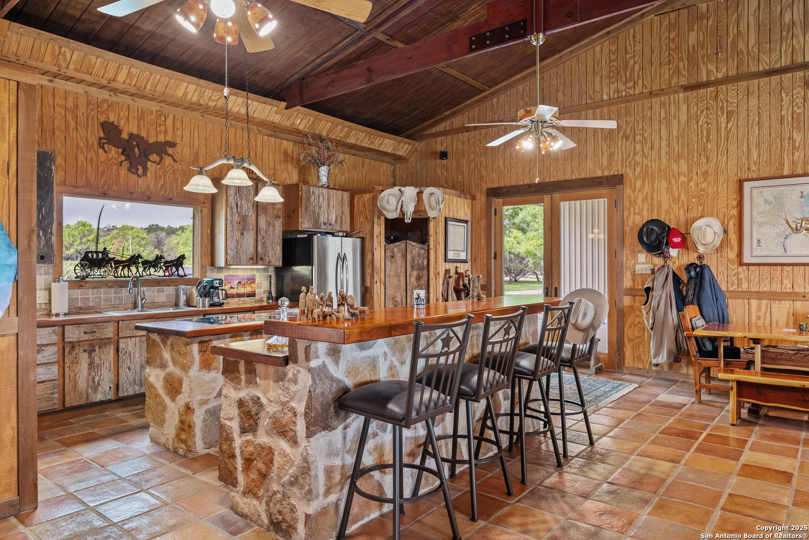 1897 Kyle Ranch Road Bandera, TX 78003 - Photo 2 of 48 a view of a dining area with furniture and chandelier
