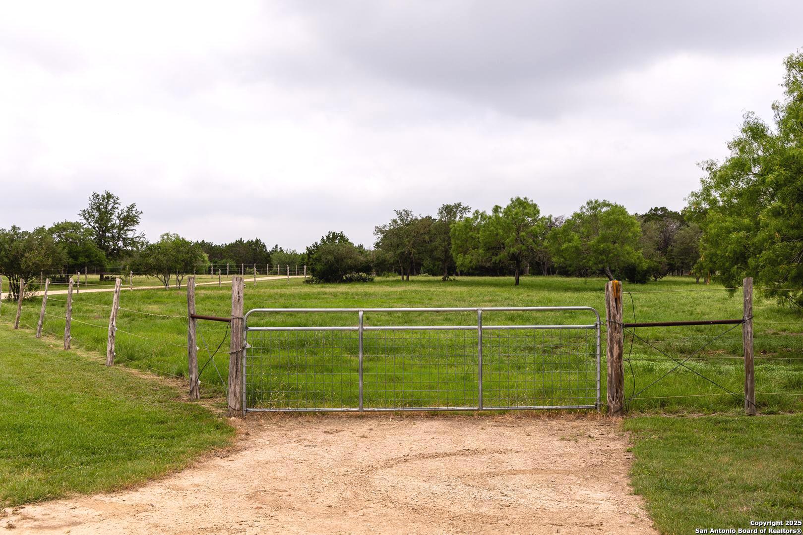 1897 Kyle Ranch Road Bandera, TX 78003 - Photo 23 of 48 a view of a tennis court