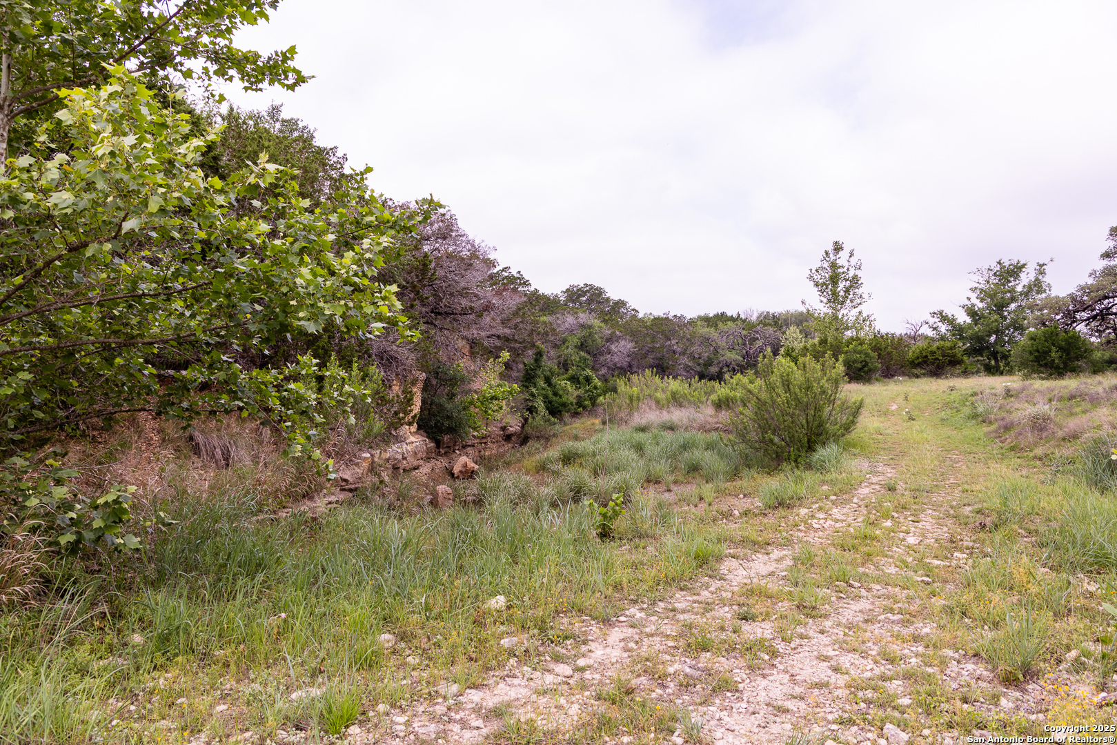 1897 Kyle Ranch Road Bandera, TX 78003 - Photo 41 of 48 a view of a lake view with houses in back