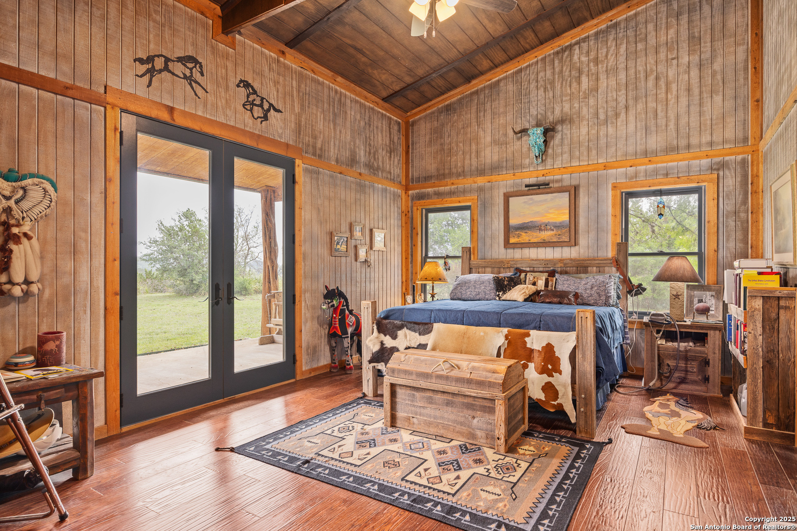 1897 Kyle Ranch Road Bandera, TX 78003 - Photo 5 of 48 a living room with furniture a wooden floor and next to a window