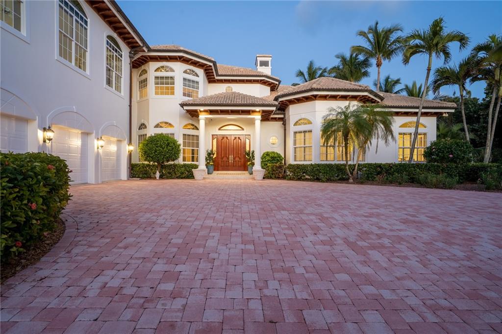 181 Ocean Beach Trail Vero Beach, FL 32963 - Photo 20 of 35 a front view of multiple houses with yard