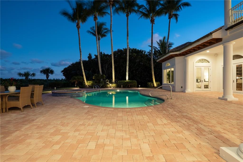 181 Ocean Beach Trail Vero Beach, FL 32963 - Photo 26 of 35 a view of a backyard with palm trees