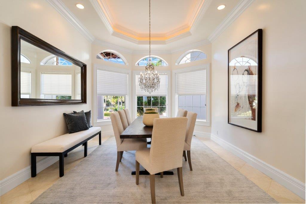 181 Ocean Beach Trail Vero Beach, FL 32963 - Photo 3 of 35 a view of a dining room with furniture window and wooden floor