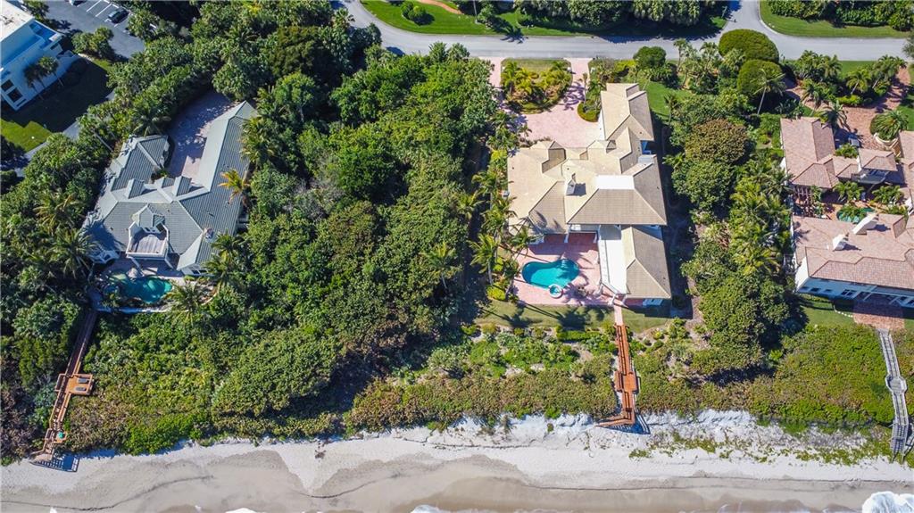 181 Ocean Beach Trail Vero Beach, FL 32963 - Photo 35 of 35 an aerial view of a house with a yard and garden